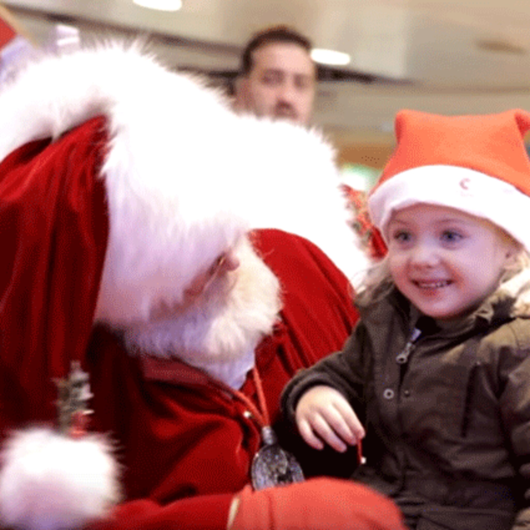 vertederend kerstman gebruikt gebarentaal voor doof meisje