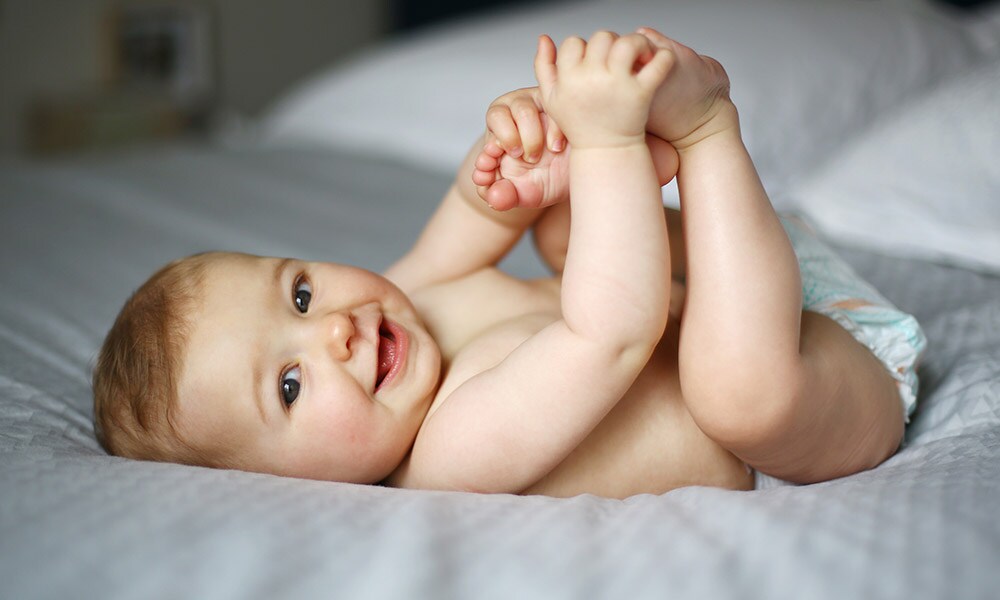 Heeft je baby last van koude, paarse handjes? Dit is de oorzaak Getty Images