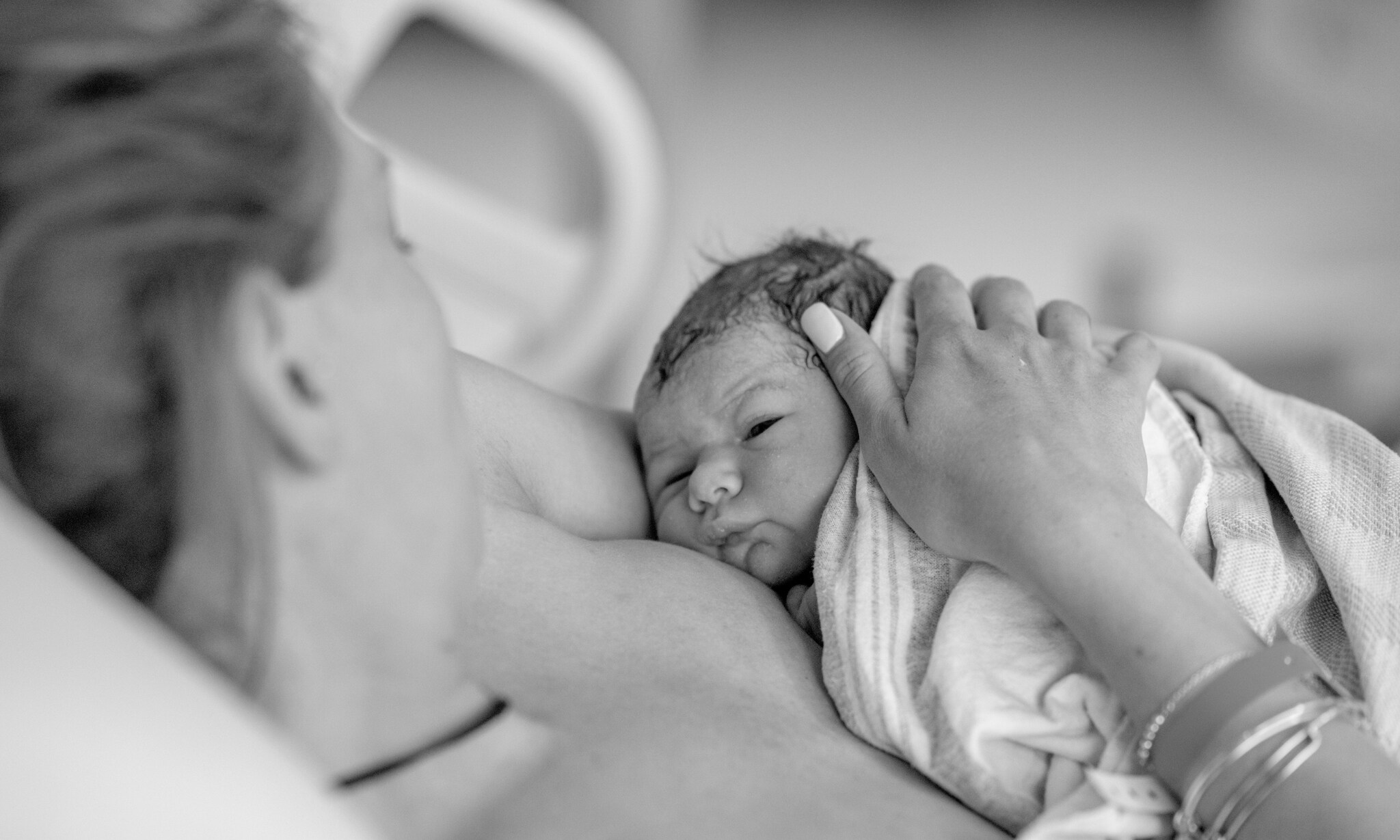 Bevallingsverhaal: moeder kijkt naar baby Getty Images