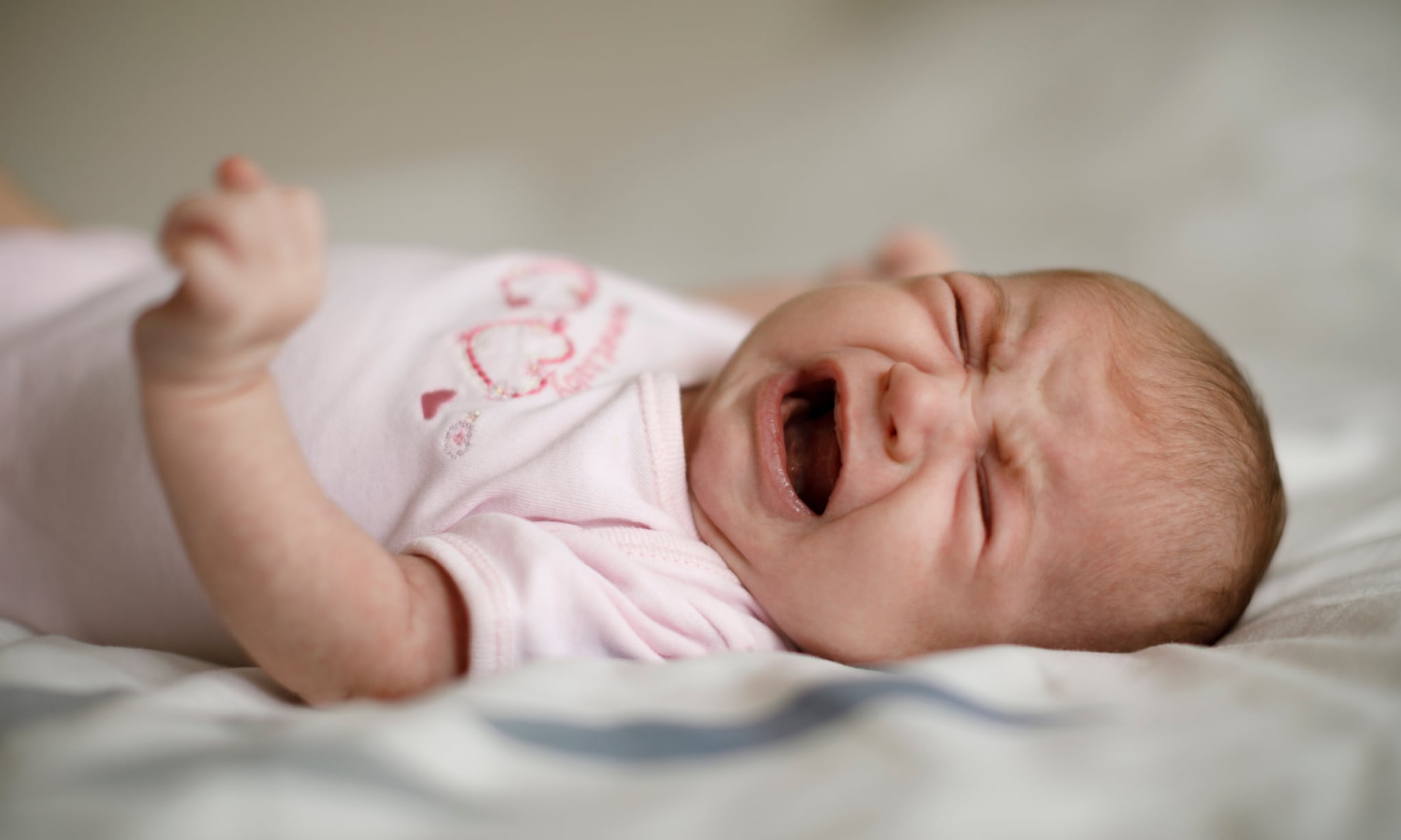 Baby laten huilen of niet? Getty Images