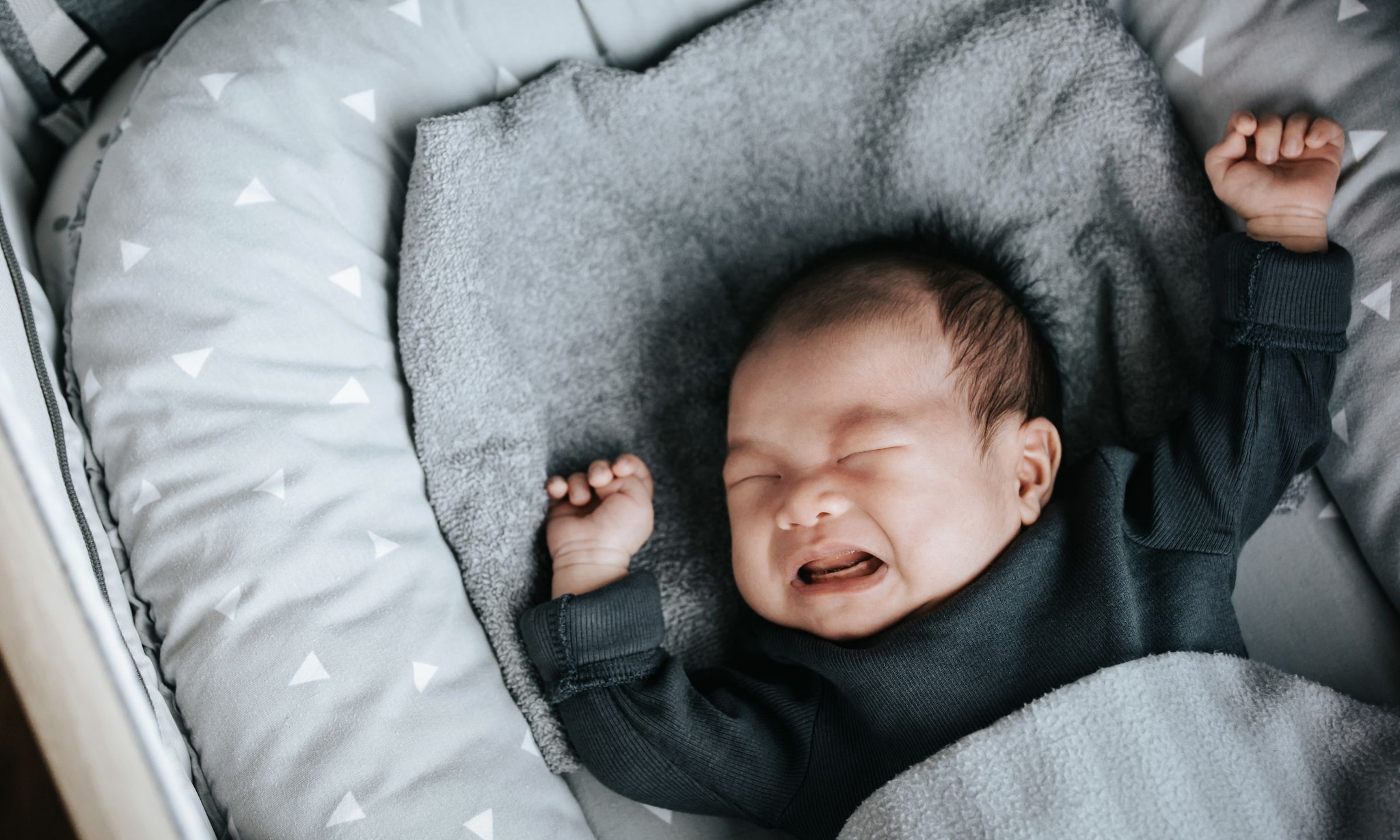 Baby huilt in slaap Getty Images