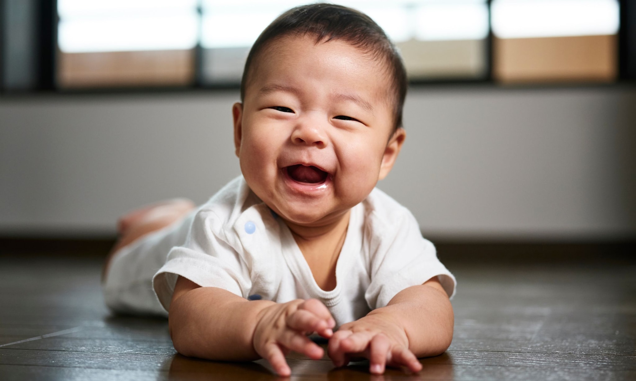 Wanneer gaat een baby lachen? Getty Images