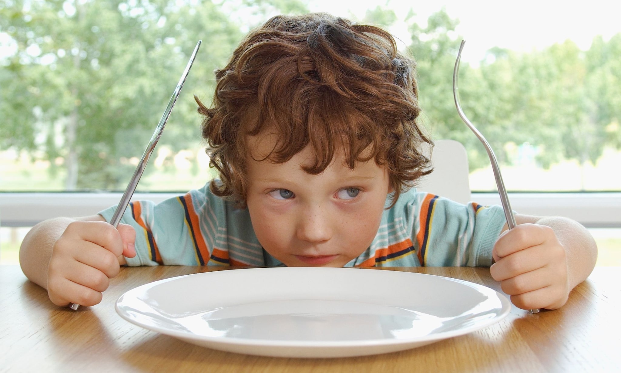 Tafelmanieren: wat kun je verwachten van een kind? Getty Images